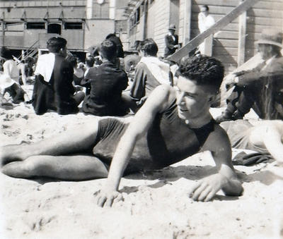 Young man with Manly Surf Club in the background