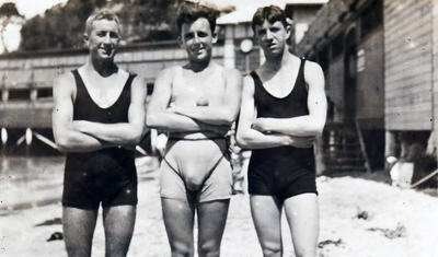 George Pike, Jack McCauley and Don Aitken of Manly Surf Club, with the surf club pavilion in the background