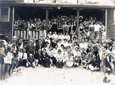 Group portrait of members and friends outside a surf pavilion possibly North Steyne