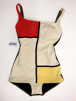 Bri-nylon black white and red and yellow squares very much like the designs of Mondrian overhanging skirt inset mesh cups black trim on front machine sewn logo diver sewn on LHS bottom corner, logo 3.