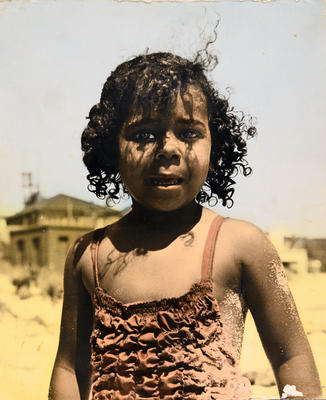 Young aboriginal girl (? possibly from the Far West Home) on a beach