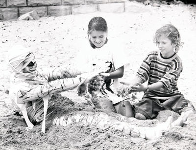 Egyptian Fun Day - children and mummy in sand