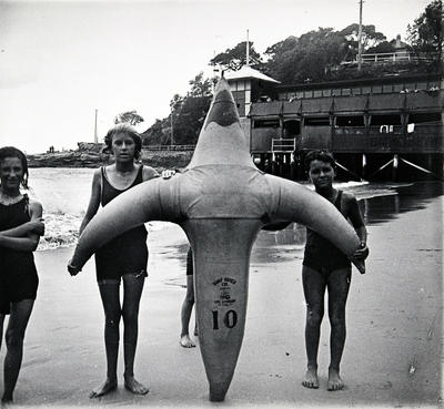 Children and an inflatable surf-rider