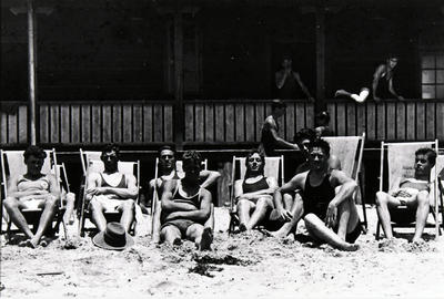 Group portrait of members of Manly Surf Club outside the Surf Pavilion