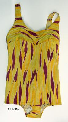 Yellow lemon white and plum tiger markings design round neckline scoop back with zip down back (26cm) plus hook and eye fastening at top of zip elastic at sides of legs, modesty skirt, probable rayon, rubber, cotton