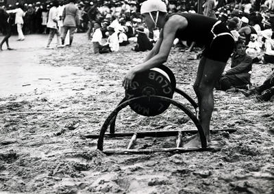 Lifesaver in action during a surf carnival on Manly Beach