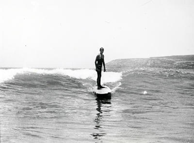 Young man surfing