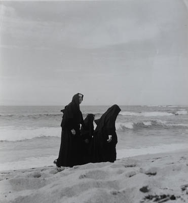 Three nuns walking on Newport Beach