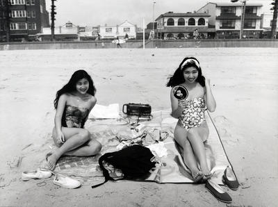 2 Japanese girls sun bathing in hard nor easter