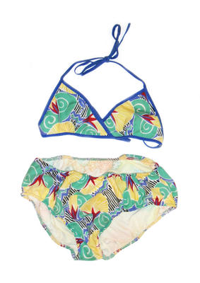 Brief printed polyester bikini in green, blue, red & yellow. Contrast blue cotton bias binding trim the top & forms the tie straps. The pants are lined with nylon & elasticised at legs & waist.