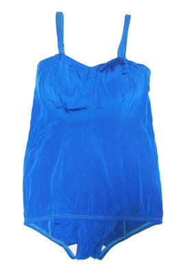 Bright blue female rayon lastex one piece with cross-over straps, boned bustline and modesty skirt.