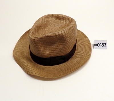 Street hat synthetic beige with brown petersham band oval top indented machine sewn with nylon thread.