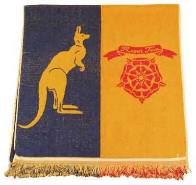 Red, yellow and blue cotton towel featuring a lion, English rose, kangaroo and wattle motif (royal tour banner?)