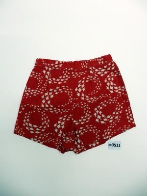 Redcotton shorts with white fish printed pattern, white button on LHS above zipper, hand made