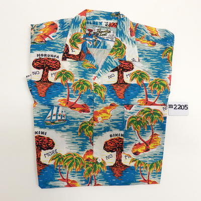 Paradise Lost' Hawaiian shirt designed by Pam Debenham in protest against nuclear bombing in the Pacific Islands, the shirt was originally featured in a screen printed poster that Pam Debenham created in 1984 called 'NO NUKES IN THE PACIFIC'