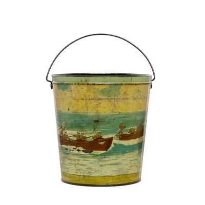 Metal beach bucket painted scene all around life savers in rowing boats in surf cream coloured sky brown boats metal handle plain metal lid