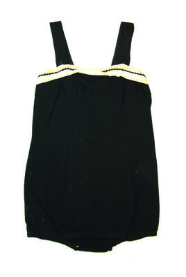 Black nylon one piece white trim with black embroidery and two pleats at top shoulder strap fastened by buttons front panel to hip label if Catalina size 44 machine sewn, see 512 stained