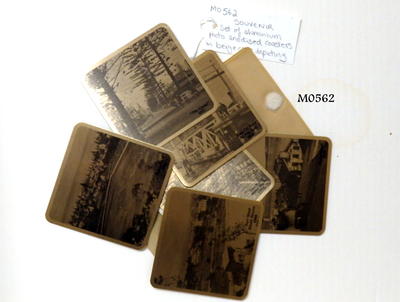 3 sets of aluminium photos - anodised coasters in beige cases depicting 'Manly Oval 1902, The Corso 1915 Manly Watershute 1904, tram at spit 1921 and surfshed South Steyne 1898, Manly Wharf 1879 machine made