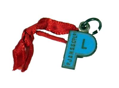 Medallion metal light blue enamel gold text dotted border shape of a 'P' loop hole on top metal ring linked red ribbon