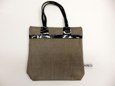 Black and white checked cloth covered vinyl bag with shiny black trim & handles