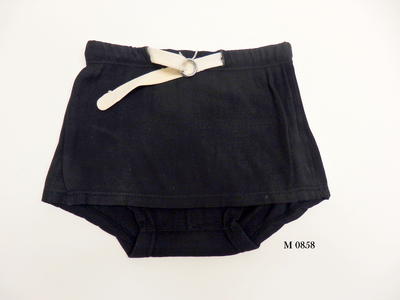 Black cotton ribbed skirted trunks, white cotton belt through waistband casing with two silver ring