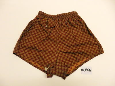 Cotton, rust and tan diamond checked, inside pocket with flap and white and gold button, cord tie