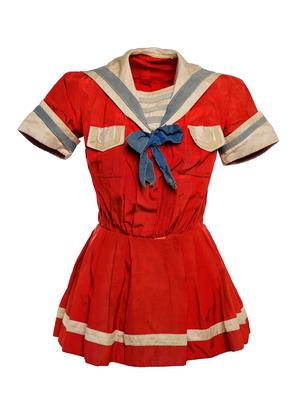 Silk red with blue and white trim tunic sailor style pleated skirt over elastic leg bloomers short sleeves flap pockets on bustline sailor collar with bow front opening to waist m-m