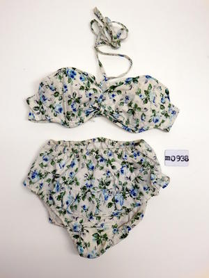 Cotton blue and white floral print front frill on bikini bottoms halterneck top with tied back neck and center, parts have fill across front, the bust is boned to maintain shape.