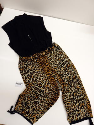 Culotte suit cotton cheese cloth black bone orange animal print loose shape silver zipper don front of suit open turtle neck collar tied straps at leg bottoms machine made