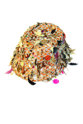 Basic straw cloche covered with a crocheted raffia net which is decorated allover with cellulose sequins of many shapes,