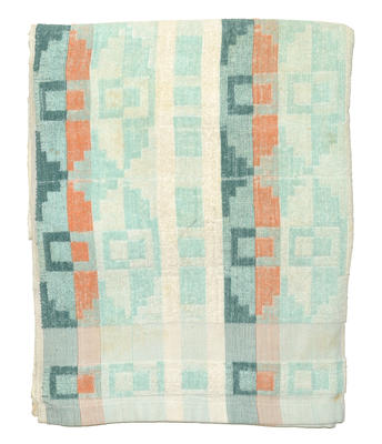 White cotton towel with green & orange colours in an Aztec design at top & bottom.