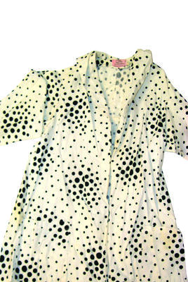 white cotton beach coat with black spots, long sleeves, shawl collar, two pockets, pleated back with bow, no fastenings, machine sewn, "Cole of California" label. size M