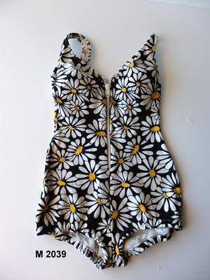 White, yellow, & black daisy print. White plastic zip down front YKK zip nylon gusset brinylon fabric low cut back Jantzen logo 2 visible left hand side