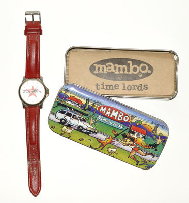 Mambo Time Lord watch with red leather band in metal case with Mambo picture on top - wind and not battery