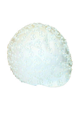 White rubber bathing cap with a molded relief of stylised flowers and Vs.