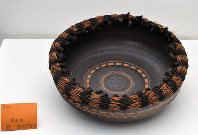 black platter with terracotta carved design