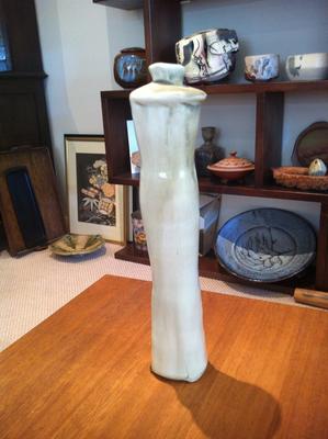 tall bottle with 2 thumbnail motifs