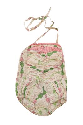 White cotton with pattern of pink and green bows. pink trim gathered across bust line, elastic shirred back, gathered bodice and legs, two straps to tie at back, lined with white cotton, 'Sun Fun' label. Machine sewn