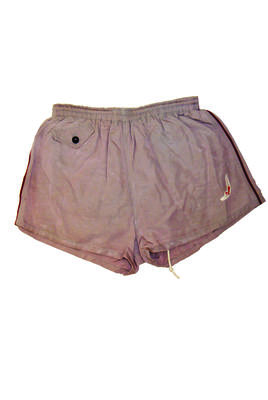 Mauve trunks with maroon trim down sides, loose-leg style, 'velva-cord' rayon mercerised cotton and latex yarn, elasticised and drawstring waist with white cord, inner undergarment and coin pocket. 'Jantzen' logo on LHS and 'Jantzen' label inside, size 34