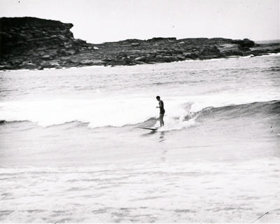 Young man riding a surfboard