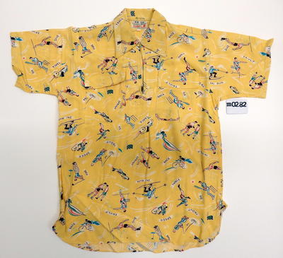 Yellow with various sports represented and titled two chest pockets short sleeves zip neck S13