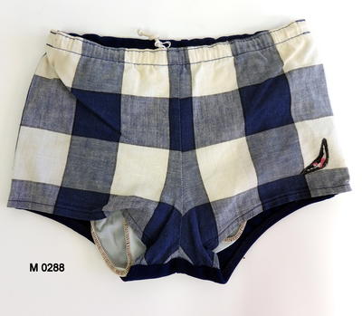 Trunks in woven blue and white checks (large) separate lining in nylon back of trunks in plain blue nylon drawstring with cord Jantzen logo LH front Size28 Machine sewn