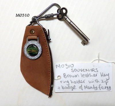 Brown leather key ring/holder with zip and badge of Manly Ferry hinged on front