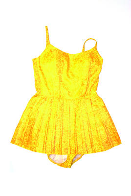 Yellow and orange floral design with pleated skirt shirring inset cups and adjustable straps fully lined machine sewn polyester