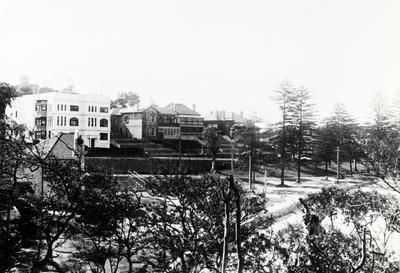 East across West Esplanade Reserve showing residential buildings in West Esplanade, the Bandstand in the Reserve and Pine Trees