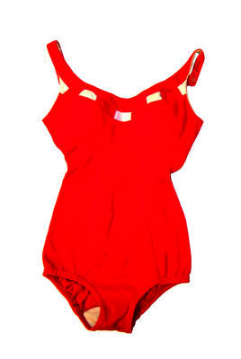 Stretch bri-nylon red with white weave design around neck line ending in a bow centre back inset cups button straps elastic around legs machine made size 32