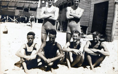 Members of Manly Surf Club with the Manly Surf Club Pavilion in the background