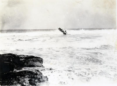 Surf-boat piercing a wave during a surf carnival at Newcastle