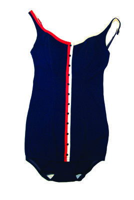 Bri-nylon blue with red (RHS) & white (LHS) trim running down centre front twelve black buttons sewn on centre stripes panel construction machine made button straps size 34; Modesty skirt and low "v" back neck and adjustable straps.