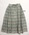 Cotton skirt with thin black, pink, green, yellow and white horizontal stripe, buttons down the front. Machine sewn, eight pleats off waistband